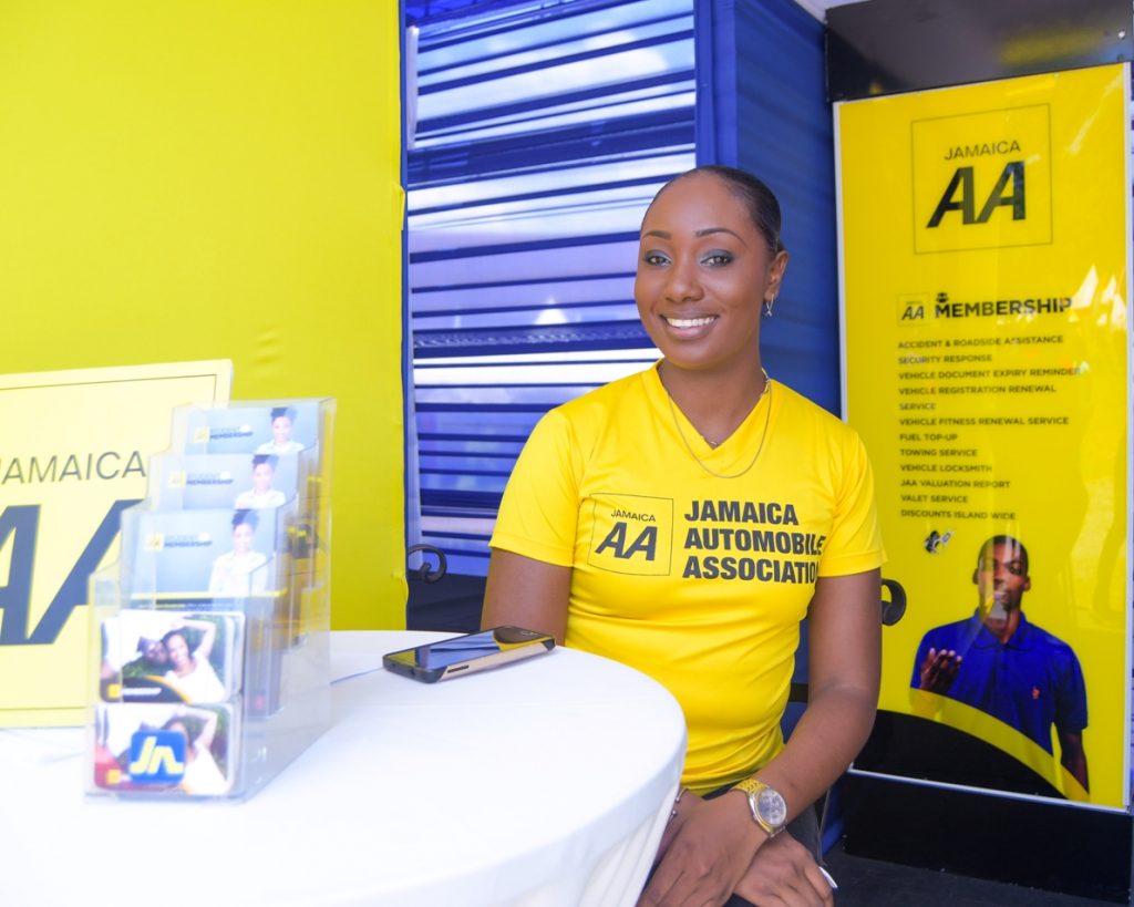 Lundie Martin (left), JAA Driving Academy coordinator, in the JAA booth at the UWI student orientation on the Mona campus in August.